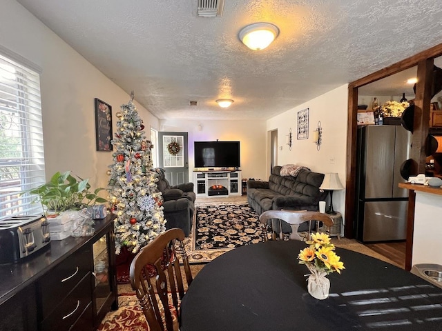 dining room featuring a textured ceiling