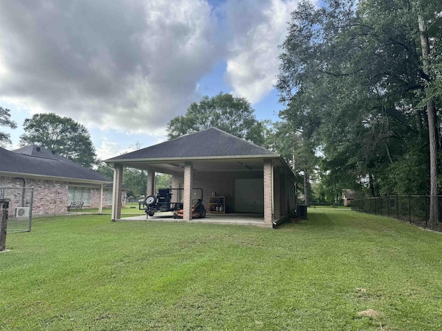 205 N Mayhaw Dr, Vidor, TX 77662 - view of yard featuring a carport