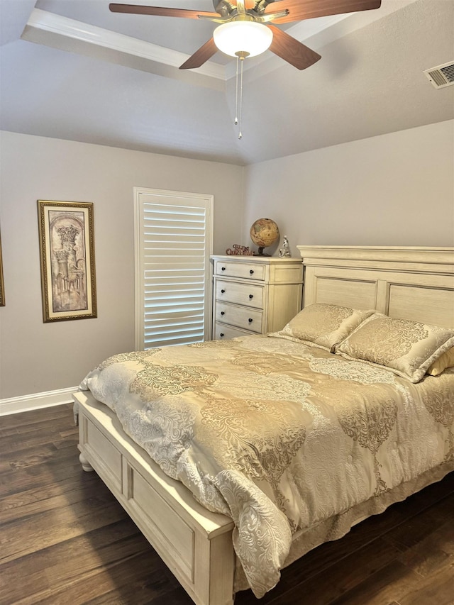 205 N Mayhaw Dr, Vidor, TX 77662 - bedroom featuring a raised ceiling, dark wood-style floors, and a ceiling fan