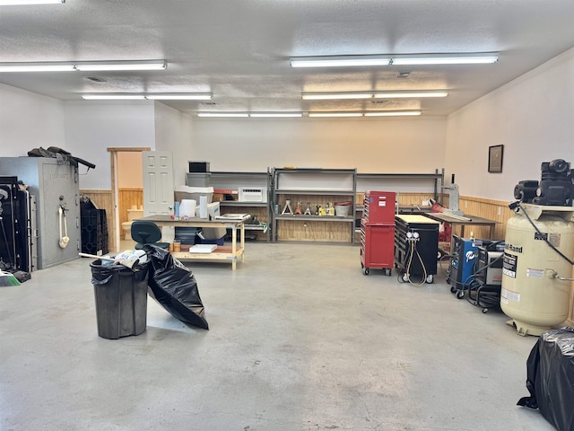 205 N Mayhaw Dr, Vidor, TX 77662 - garage with a wainscoted wall and wood walls
