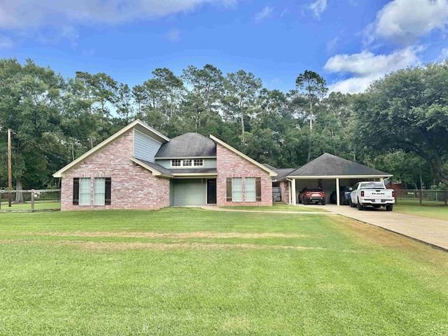 205 N Mayhaw Dr, Vidor, TX 77662 - view of front of house with brick siding, driveway, and view of wooded area