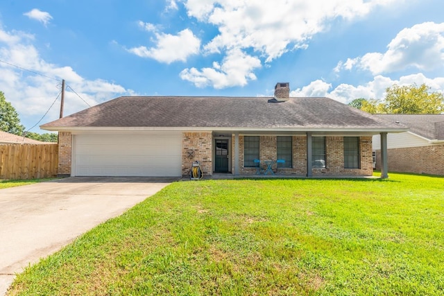 ranch-style house featuring a front lawn and a garage