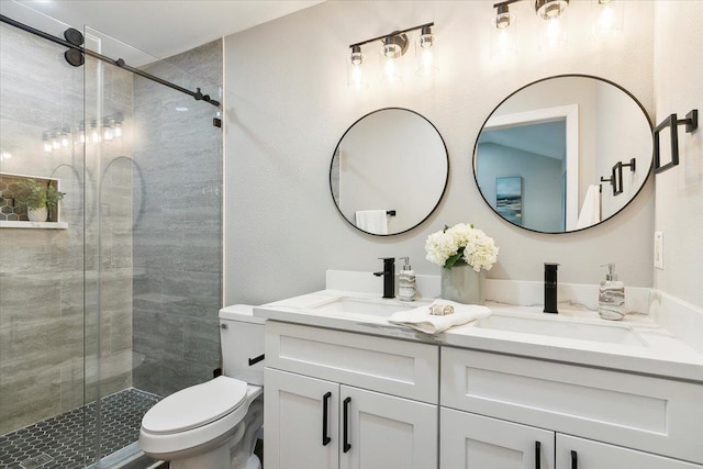 bathroom featuring a sink, toilet, and a shower stall