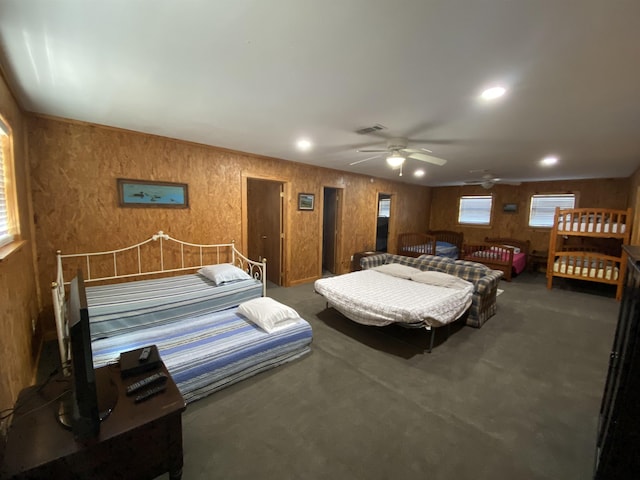 bedroom featuring dark carpet and ceiling fan