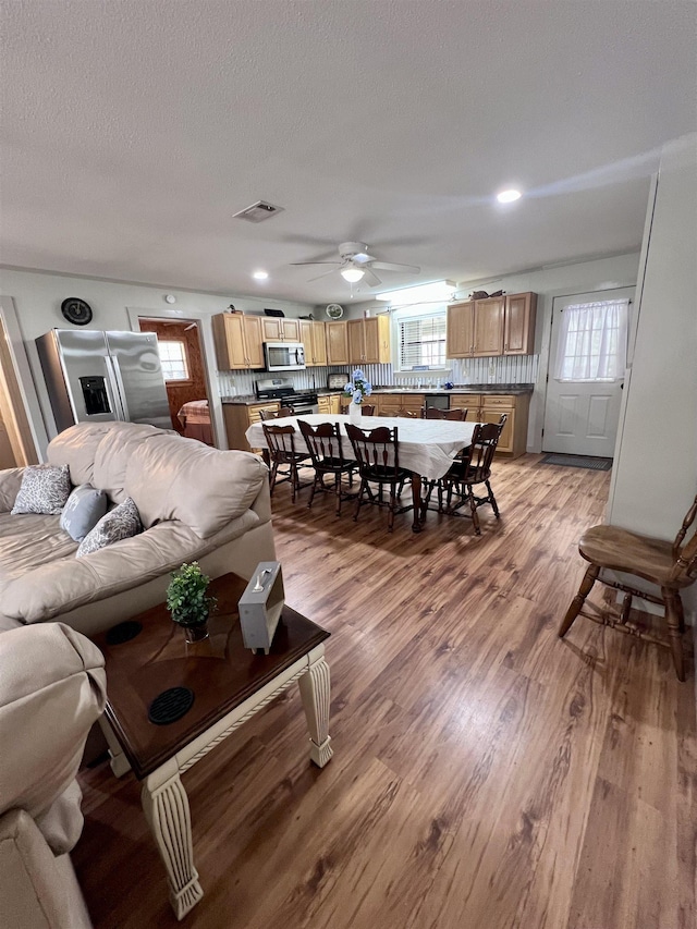 bedroom featuring ceiling fan and carpet