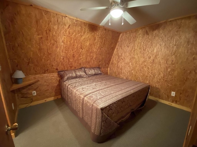 bedroom featuring ceiling fan, carpet floors, and vaulted ceiling