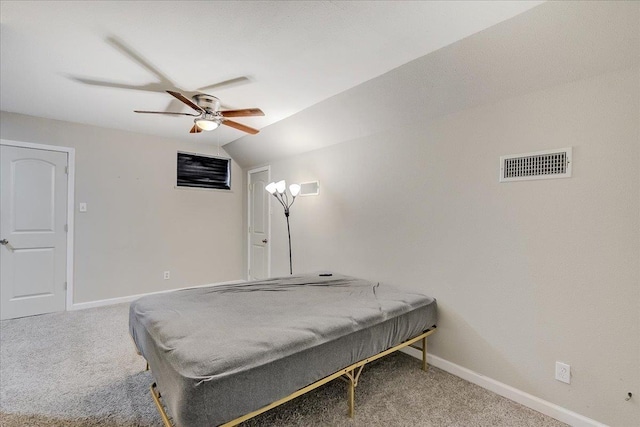 bedroom featuring visible vents, carpet flooring, baseboards, and vaulted ceiling