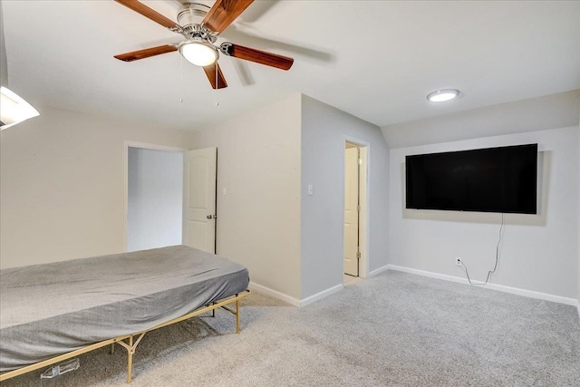 unfurnished bedroom featuring carpet flooring, a ceiling fan, and baseboards