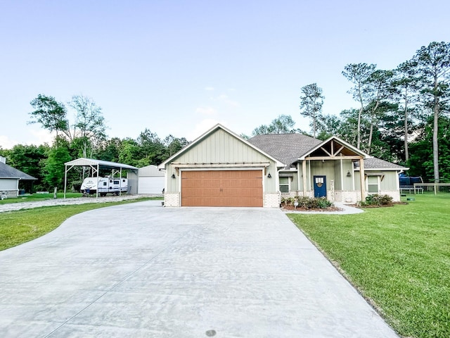 4885 Silver Leaf Dr, Orange, TX 77630 - view of front facade with concrete driveway, a front yard, board and batten siding, and a garage