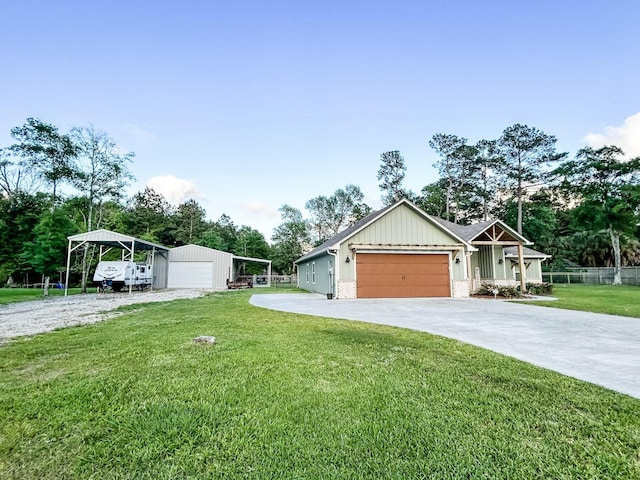4885 Silver Leaf Dr, Orange, TX 77630 - view of front of house with board and batten siding, view of scattered trees, driveway, and a detached garage