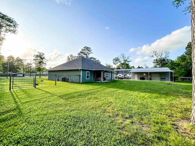 4885 Silver Leaf Dr, Orange, TX 77630 - back of property with an outbuilding and a garage