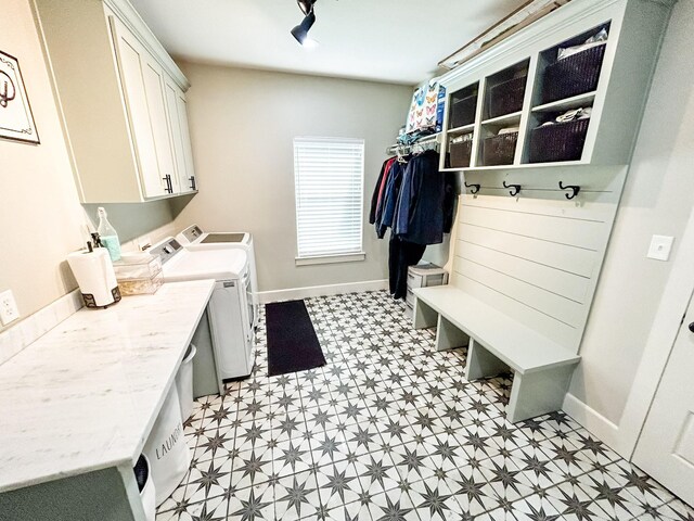 4885 Silver Leaf Dr, Orange, TX 77630 - laundry room featuring light flooring, independent washer and dryer, and cabinet space