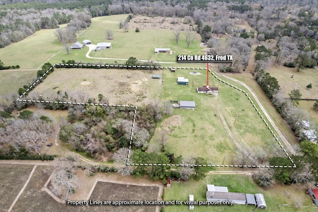 birds eye view of property with a rural view