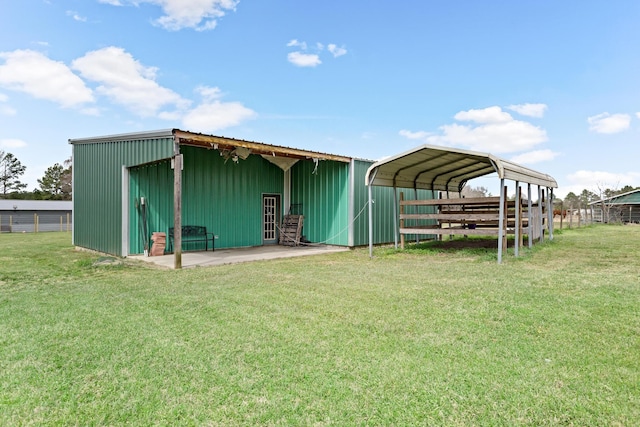 view of outdoor structure with an outbuilding and a detached carport