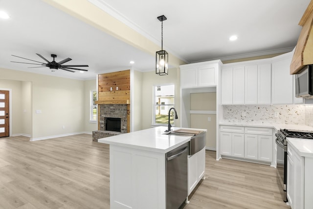 103 Ned, Lumberton, TX 77657 - kitchen with stainless steel appliances, decorative backsplash, recessed lighting, light countertops, and ornamental molding