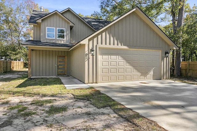 103 Ned, Lumberton, TX 77657 - view of front of property with a shingled roof, an attached garage, concrete driveway, and board and batten siding