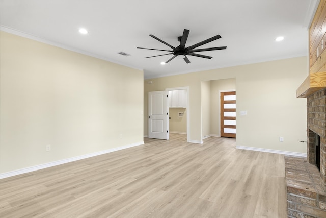 103 Ned, Lumberton, TX 77657 - unfurnished living room featuring a fireplace, ornamental molding, a ceiling fan, light wood-style floors, and recessed lighting