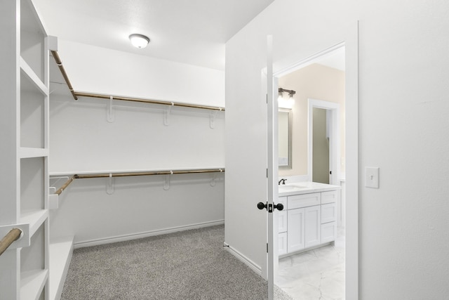 103 Ned, Lumberton, TX 77657 - spacious closet featuring a sink and light marble finish flooring