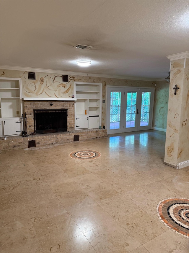 2328 Briarcliff Dr, Beaumont, TX 77706 - unfurnished living room with ornamental molding, built in features, a brick fireplace, baseboards, and a textured ceiling