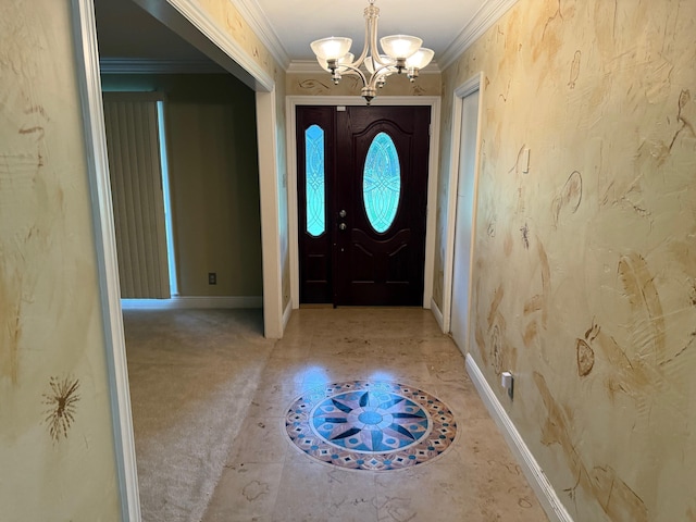entrance foyer with baseboards, an inviting chandelier, and crown molding