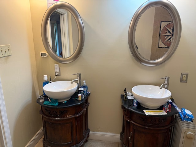 bathroom with vanity and baseboards