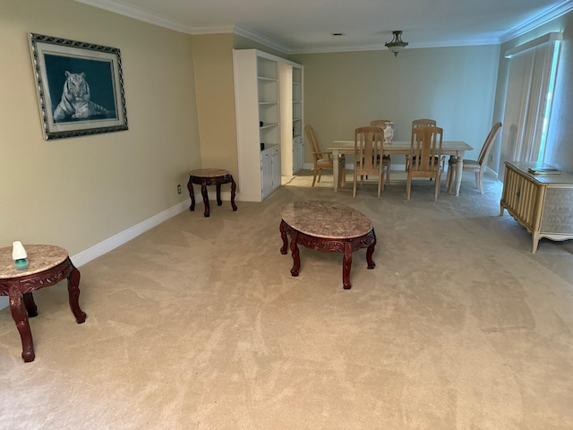 dining area featuring crown molding, baseboards, and carpet flooring