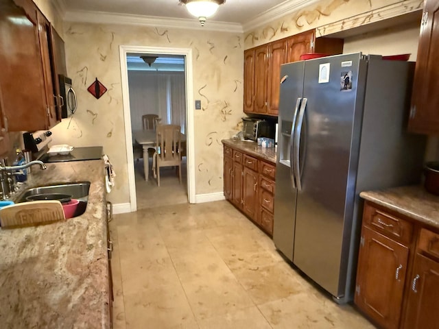 kitchen with light tile patterned floors, a sink, ornamental molding, and stainless steel fridge
