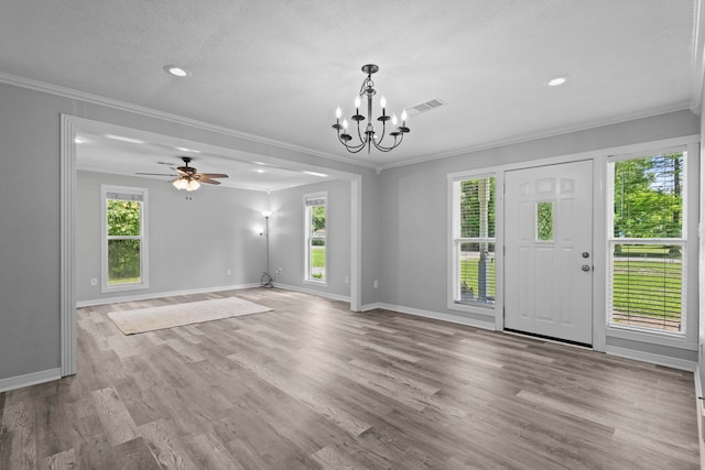 unfurnished living room featuring baseboards, ornamental molding, a chandelier, wood finished floors, and recessed lighting