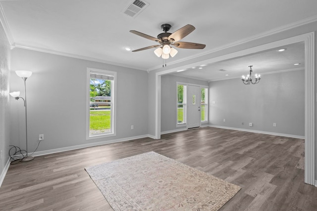 spare room with healthy amount of natural light, crown molding, ceiling fan, wood finished floors, and recessed lighting