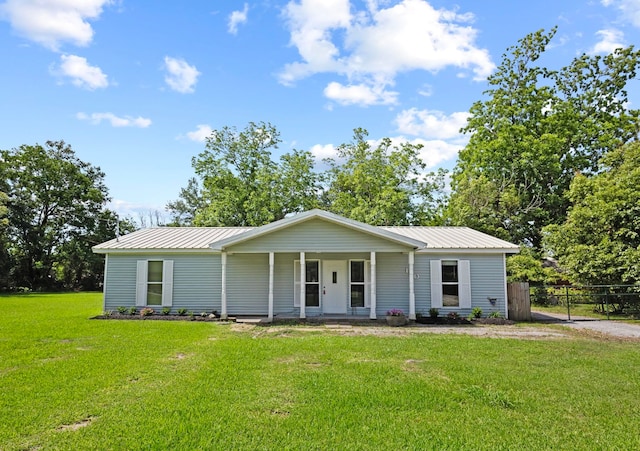 ranch-style house featuring metal roof and covered porch