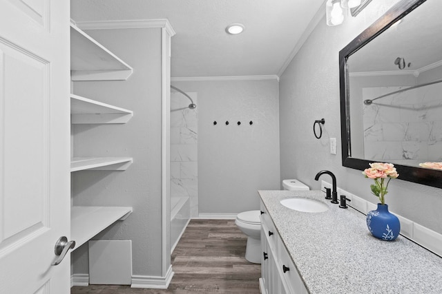 bathroom with ornamental molding, toilet, vanity, bathing tub / shower combination, and wood finished floors
