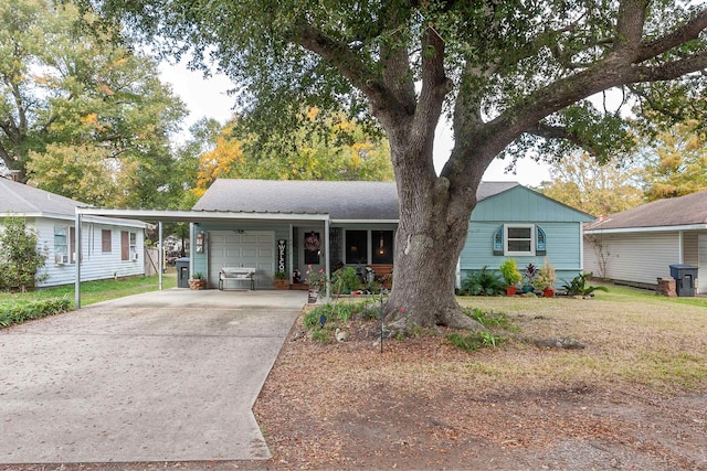 ranch-style home with a garage and a carport