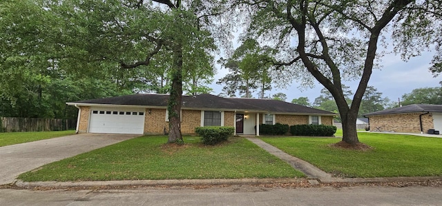 single story home featuring concrete driveway, an attached garage, fence, brick siding, and a front lawn