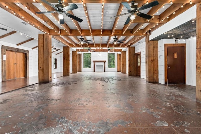 misc room with wooden walls and lofted ceiling with beams