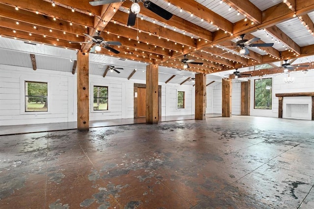 miscellaneous room featuring vaulted ceiling with beams, wood walls, and wood ceiling