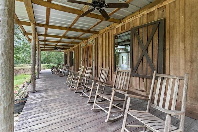 wooden deck with ceiling fan and covered porch