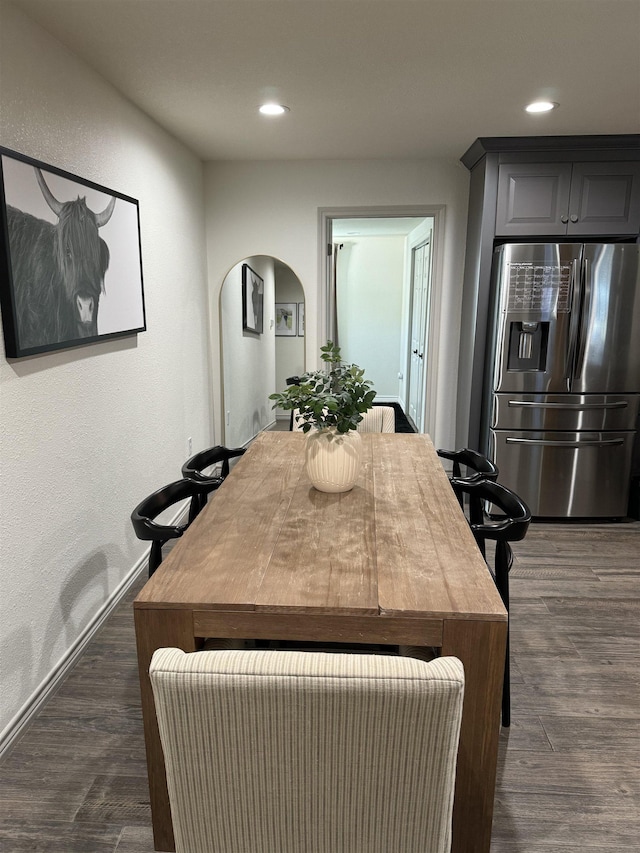 dining room with dark hardwood / wood-style floors