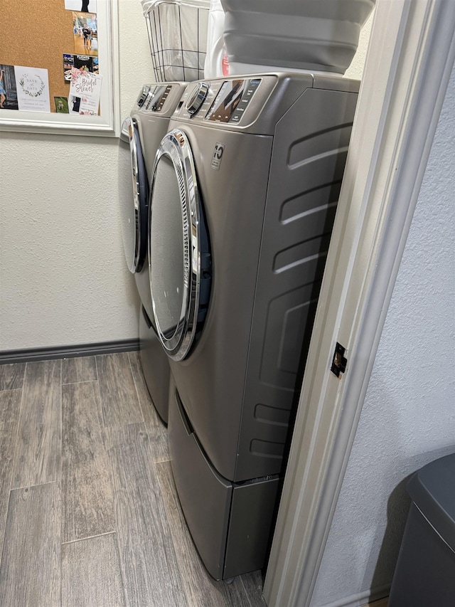 clothes washing area with washing machine and clothes dryer