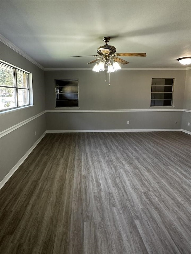 spare room with ornamental molding, dark hardwood / wood-style flooring, and ceiling fan