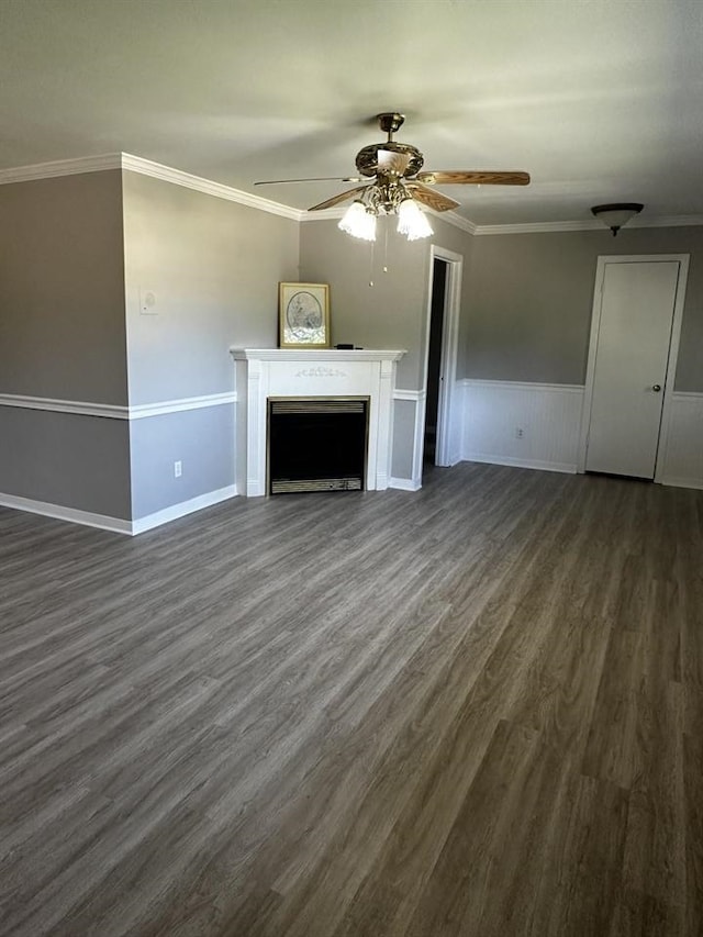 unfurnished living room with ceiling fan, crown molding, and dark hardwood / wood-style flooring