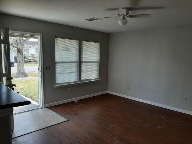 interior space with dark hardwood / wood-style floors and ceiling fan