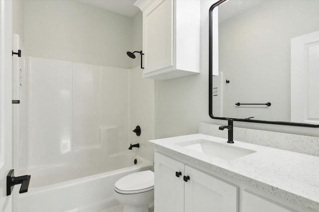 full bathroom featuring bathing tub / shower combination, vanity, and toilet