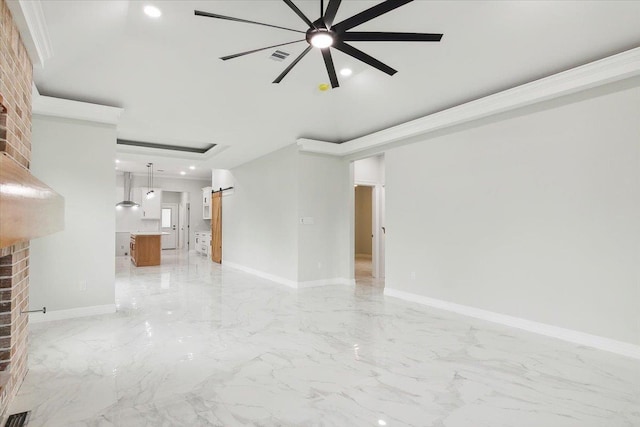 spare room featuring a brick fireplace and ceiling fan