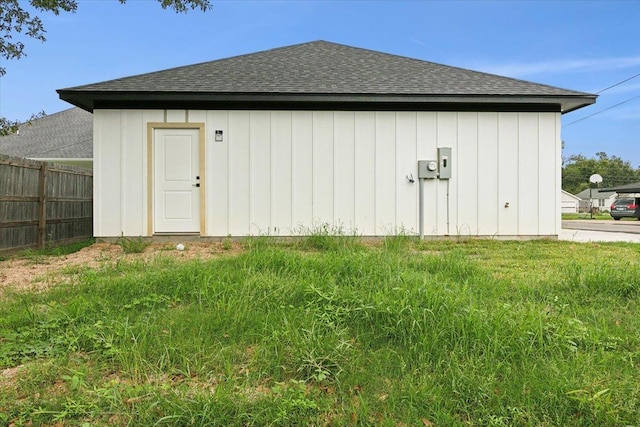 view of outbuilding with a yard