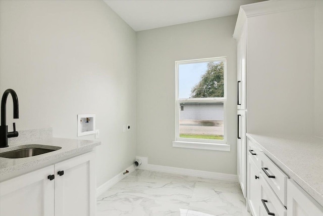 laundry room featuring hookup for an electric dryer, cabinets, sink, and washer hookup