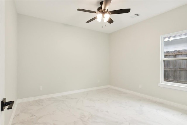 spare room with ceiling fan