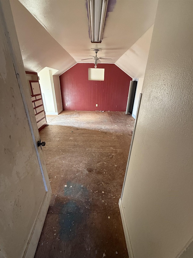 bonus room with vaulted ceiling and ceiling fan