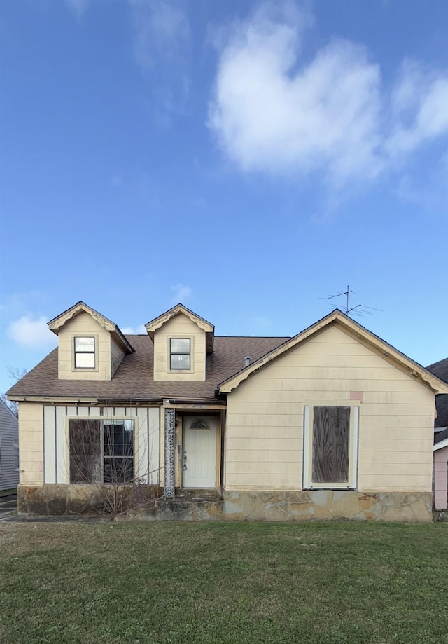 back of property featuring a yard