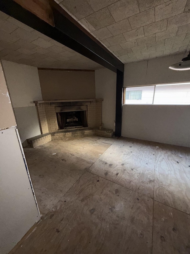 unfurnished living room featuring a fireplace