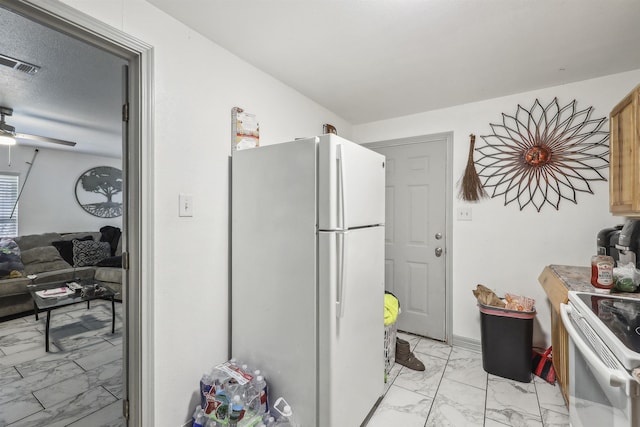 2725 29th St, Port Arthur, TX 77640 - kitchen featuring white appliances and light marble finish floors